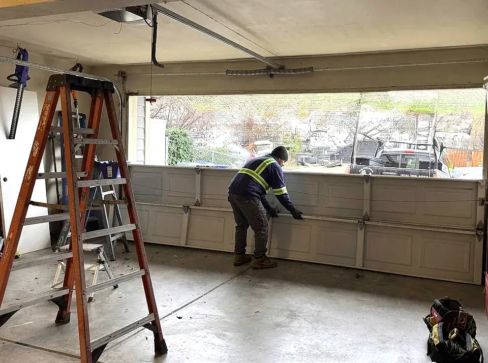 Handyman repairing residential sliding glass door
